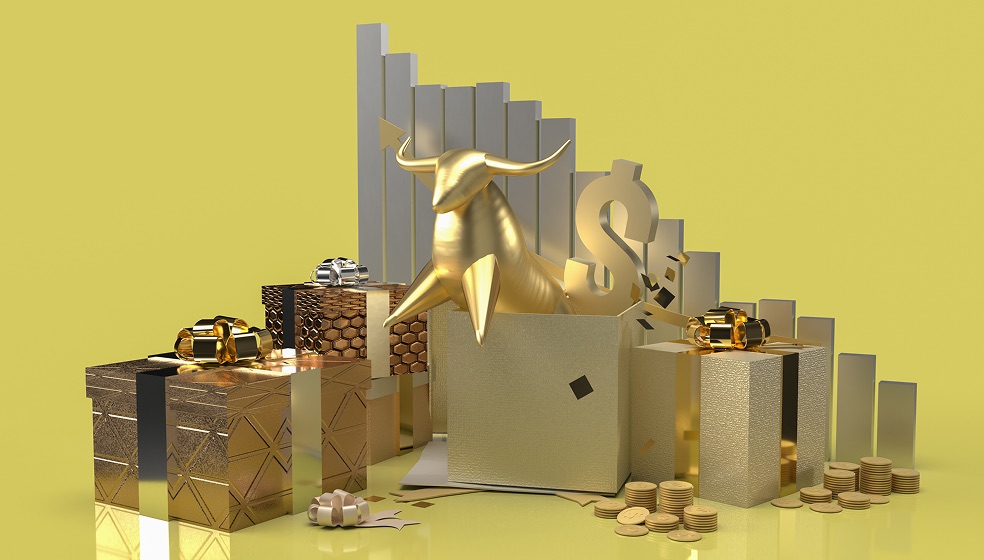 Ein goldener Bulle ragt halb aus einer goldenen Kiste hervor, daneben stehen mehrere goldene Geschenke. Im Hintergrund sieht man eine Statistik-Skala, der Hintergrund ist komplett einfarbig gelb.